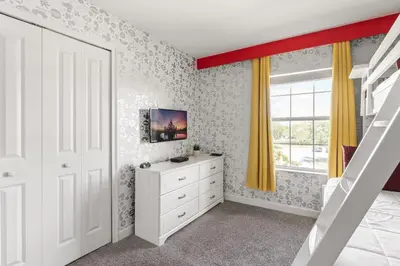 a bedroom with a white dresser and a window at Disney Getaway Villa with Private Pool Hot Tub. Book Now SLR502 in Kissimmee