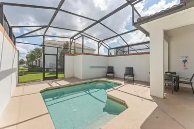 a swimming pool in a house with a glass ceiling at Disney Getaway Villa with Private Pool Hot Tub. Book Now SLR502 in Kissimmee