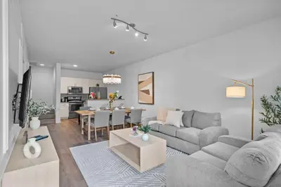 a living room with a couch and a table at Disney Getaway Private Pool Themed Bedrooms. Book Now WLV5 in Kissimmee