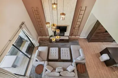 an overhead view of a living room with white furniture at Disney Getaway Townhouse with Private Pool. Book Now MVV18 in Orlando