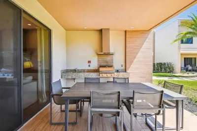 a kitchen and dining room with a table and chairs at Disney Getaway Townhouse with Private Pool. Book Now MVV18 in Orlando
