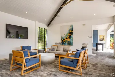 a living room with chairs and a couch at Pinnacle Apartments W Amenties by Heavenly Homes in Orlando