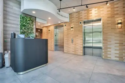 a lobby with a reception desk in a building at 2 Bdrm Penthouse with Billiards in Orlando