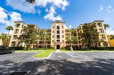 a large building with a parking lot in front of it at WorldQuest Orlando Resort in Orlando