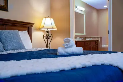 a bedroom with a bed with a towel on it at WorldQuest Orlando Resort in Orlando