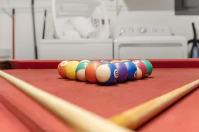 a row of billiard balls on a pool table at Single Story Villa with Pool Views and Family Fun in Orlando