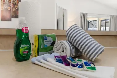 a counter with a bottle of toothpaste and toothbrushes at Single Story Villa with Pool Views and Family Fun in Orlando