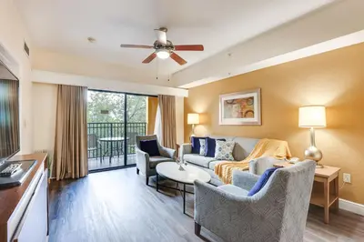 a living room with a couch and chairs at Poolside Oasis 7 Mi to Disney and Universal in Orlando