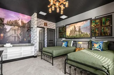 a bedroom with two beds and a chandelier at Epic Paradiso Mansion-Pool,Game Room,Theater-4 in Orlando