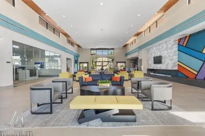 an office lobby with couches and tables at Epic Paradiso Mansion-Pool,Game Room,Theater-4 in Orlando