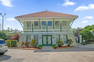 a large building with a roof on top of it at Sunny Summer Magic - Stay in TownHome by Disney in Orlando