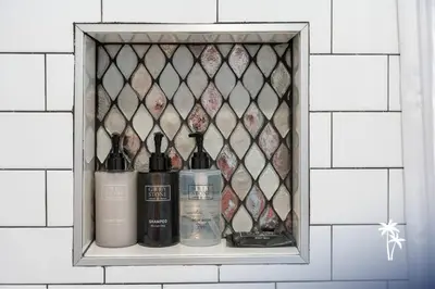 a shelf with bottles of wine on a wall at Lake View Top Floor 2 Bed 2 Bath Condo with Balcony in Orlando