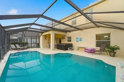 a swimming pool with a large glass roof over it at Near Disney Pool Hot Tub Stunning Water View in Kissimmee