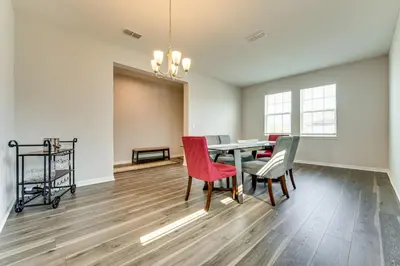 a dining room with a table and chairs at Pool Access Family Gem with Views in St Cloud! in Saint Cloud