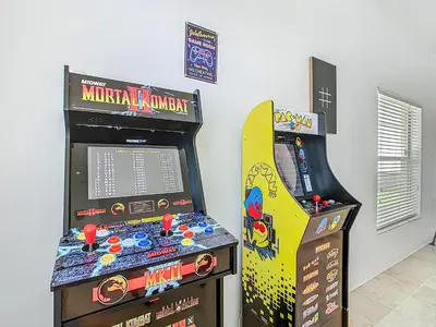 a video game room with a video game console and a video game at Themed 4BR villa w spa & pool-Close To Disney in Orlando