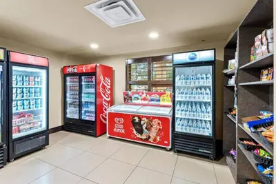 a store with two soda machines in a store at Luxury Private Apt at Disney Area in Orlando