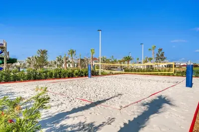 a volleyball court in the sand at a resort at Sunset Retreat at Storey Lake Resort by Shine Villas condo in Kissimmee