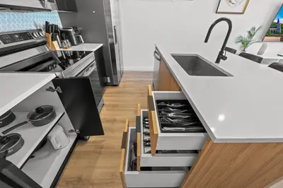 a kitchen with a sink and a stove at Modern Townhome 10min to Disney in Kissimmee