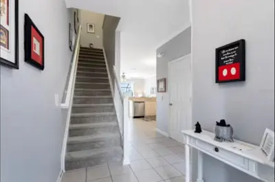 a staircase in a house with a stair case at Relaxing vacation resort villa in Orlando
