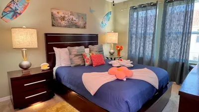 a bedroom with a bed with stuffed animals on it at Margaritaville House Close to Universal in Kissimmee