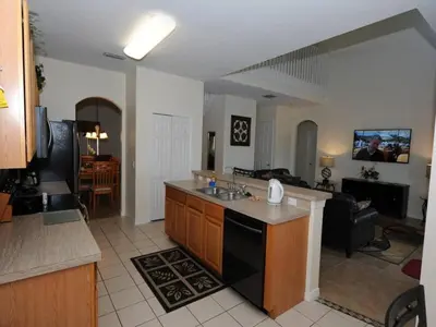 a kitchen with a sink and a counter top at Ruby-Rose Retreat by Paradise Resort Vacations in Kissimmee