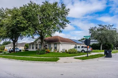 a house on the corner of a street at Flint and Kingscrest, LLC - Private Rooms in Shared Home in Orlando