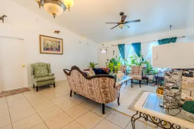 a living room with furniture and a ceiling fan at Flint and Kingscrest, LLC - Private Rooms in Shared Home in Orlando