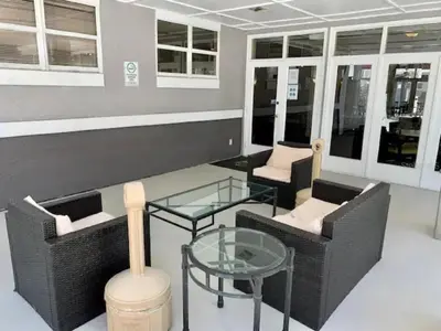 a room with two chairs and a glass table at Two bed condo in Parkway Palms Resort in Orlando