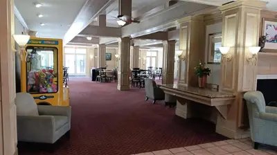 a lobby with a waiting room with a yellow train at Two bed condo in Parkway Palms Resort in Orlando
