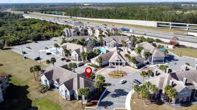 an aerial view of a residential neighborhood with houses at Parkway Palms Resort 1 bed condo mins to Disney. in Orlando