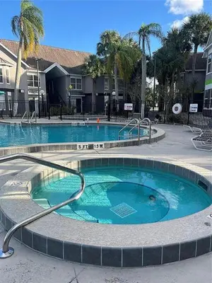 a large swimming pool in a resort at Parkway Palms Resort 1 bed condo mins to Disney. in Orlando
