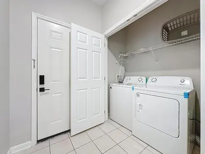 a laundry room with a washer and dryer at Beautiful Three bed condo, Minutes from Disney in Kissimmee