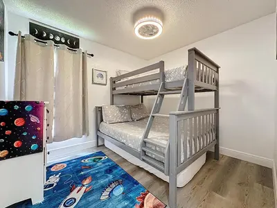 a bedroom with a bunk bed and a ladder at Terra Verde Resort 4 Bed Pool/Spa Villa in Kissimmee