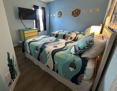 a bedroom with two twin beds in a room at Emerald Island Resort 6 Bed Pool & Spa in Kissimmee