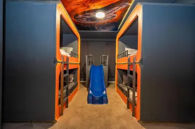 a room with a room with a blue slide at Stunning Mansion 15 ensuites in Kissimmee