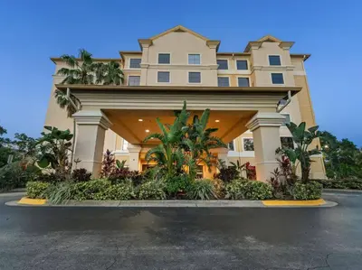 a large building with a lot of plants at SkySuite 5min to Universal Park in Orlando