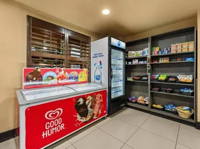 a store with a coca cola counter in a store at SkySuite 5min to Universal Park in Orlando