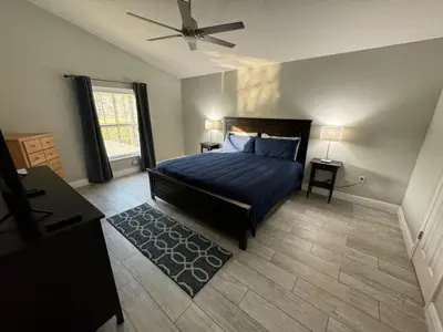 a bedroom with a bed and a ceiling fan at Casablanca Villa home in Kissimmee