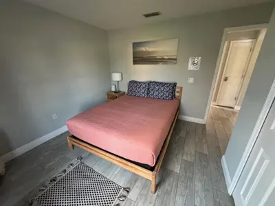 a bedroom with a bed with a red mattress at Casablanca Villa home in Kissimmee