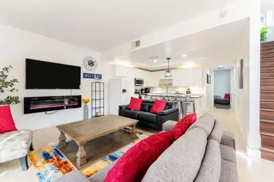 a living room with a couch and a table at Royal Homes in Kissimmee