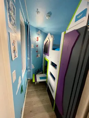 a childs room with a bunk bed in a room at Wands & Wishes | Luxury Condo Minutes from Disney in Orlando