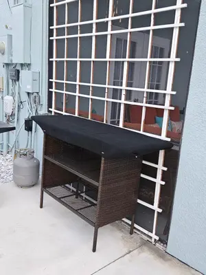 a window with bars on it next to a building at Charming, beautiful house closer to Disney World in Orlando
