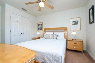 a bedroom with a bed and a ceiling fan at Bright 3B w Pool Close to Disney Encantada 8545 in Kissimmee