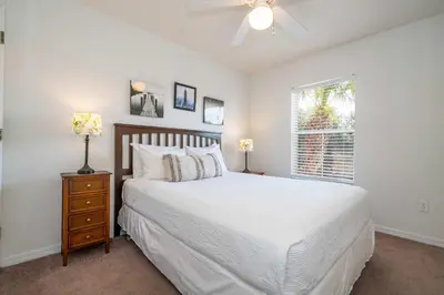 a bedroom with a white bed and a window at Bright 3B w Pool Close to Disney Encantada 8545 in Kissimmee