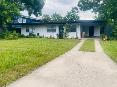 a house with a driveway in front of it at Entire 5 Bedroom Home in Winter Park FL in Orlando