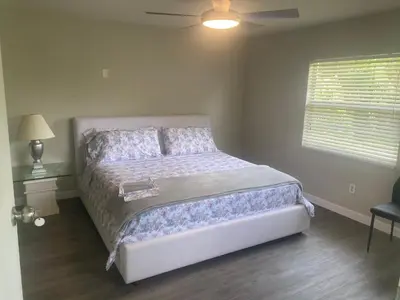 a bedroom with a bed and a ceiling fan at Entire 5 Bedroom Home in Winter Park FL in Orlando
