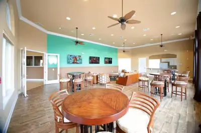 a dining room with a table and chairs at Casa Bella Vida Resort Kissimmee in Kissimmee