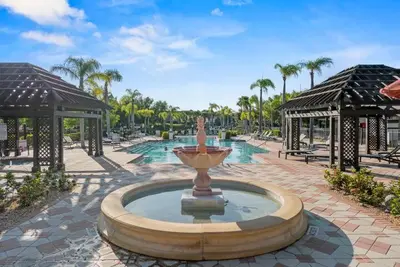 a fountain in the middle of a courtyard at Casa Bella Vida Resort Kissimmee in Kissimmee