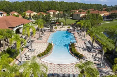 an overhead view of a swimming pool at a resort at Casa Bella Vida Resort Kissimmee in Kissimmee