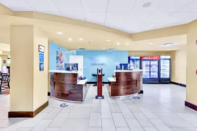 a lobby of a fast food restaurant with two counters at 1BR Apartment Close to Disney w Pool and Hot Tub in Orlando